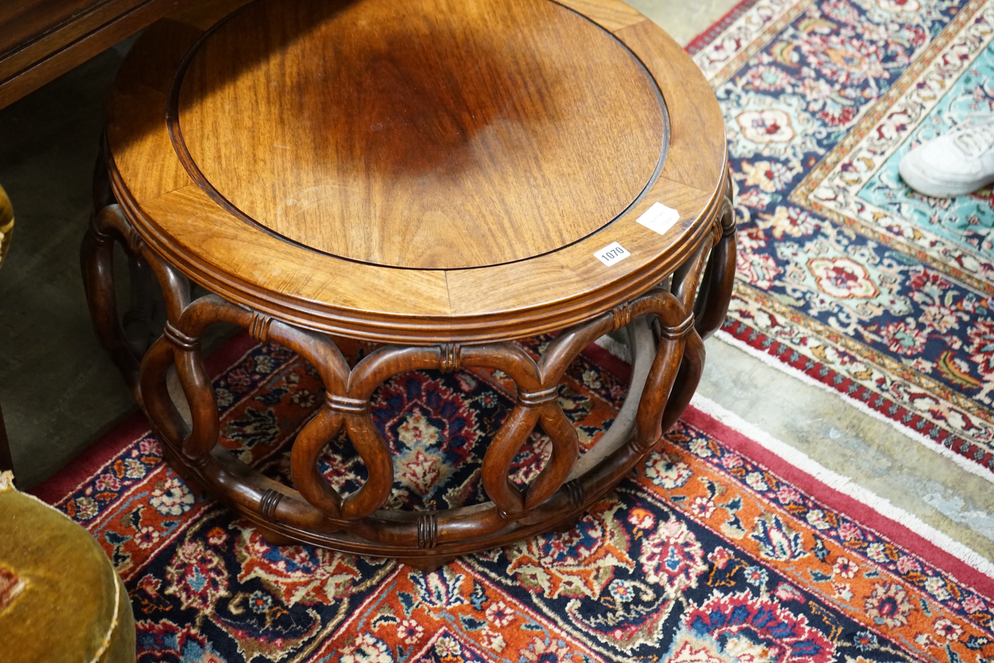 A Chinese padouk wood circular coffee table, diameter 67cm, height 42cm